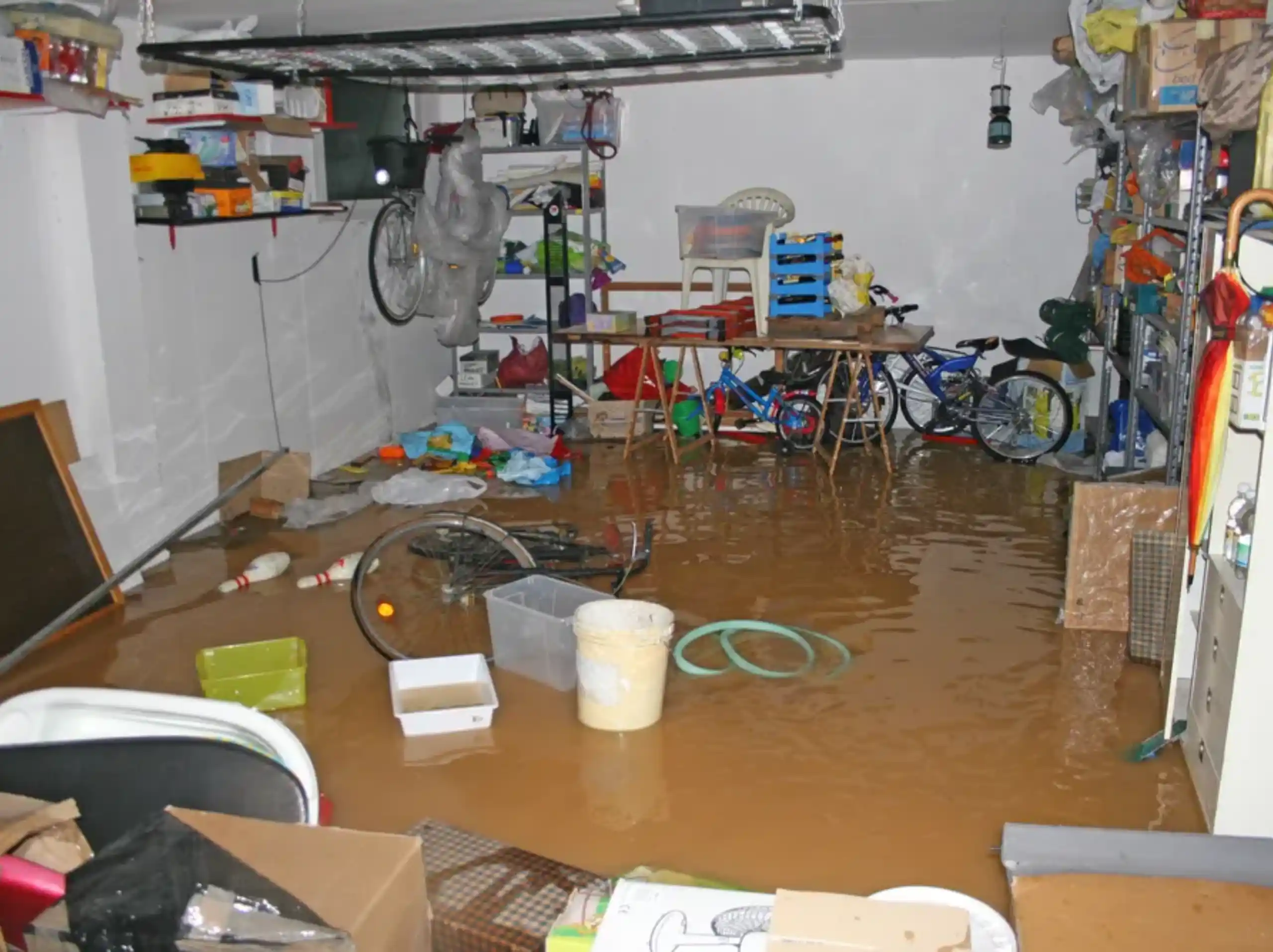 Flooded garage requiring emergency water extraction